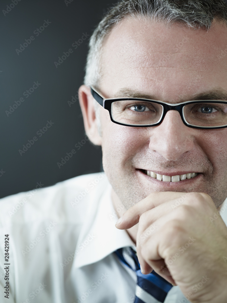 confident businessman smiling at camera confident businessman smiling at camera