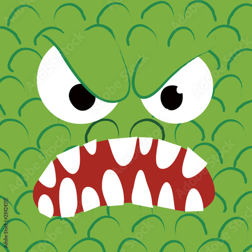 Faccia di mostro verde arrabbiato e pauroso photo
