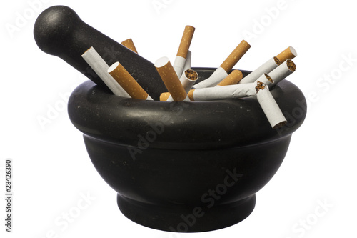 Quit smoking - pestle with cigarettes isolated over white