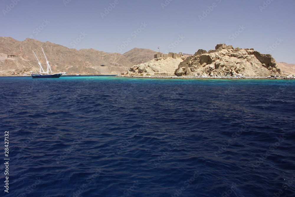 island with stronghold and boat in Red Sea - Egypt, Africa