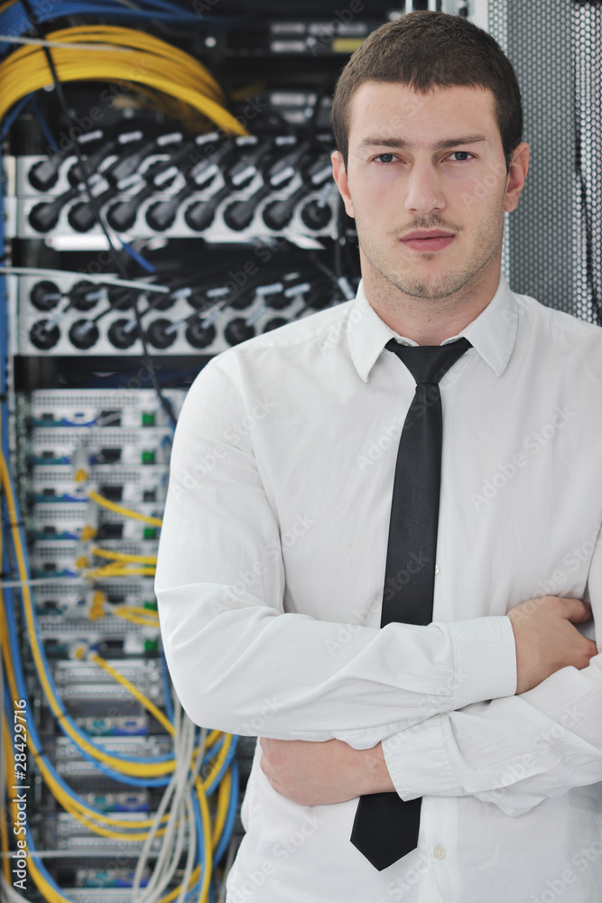 young engeneer in datacenter server room young engeneer in datacenter server room