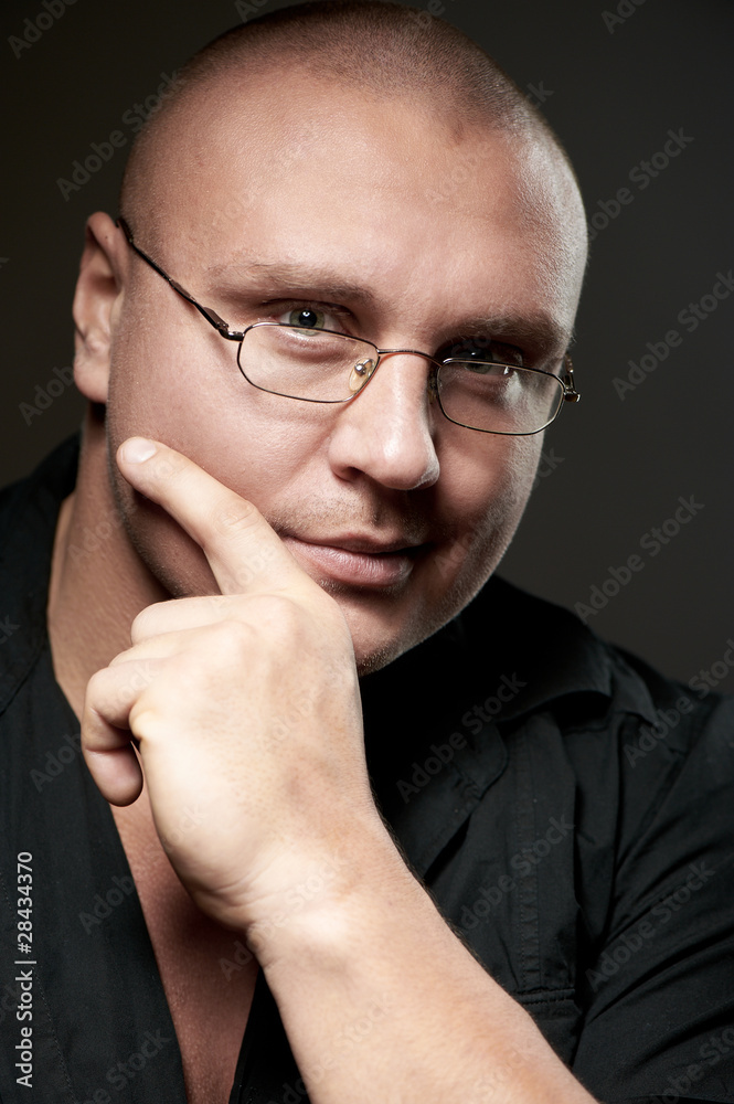 Positive portrait of serious man in eyeglasses Positive portrait of serious man in eyeglasses