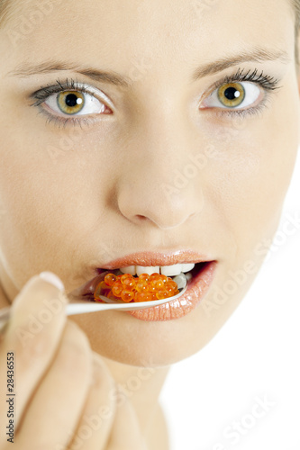 portrait of woman with red caviar