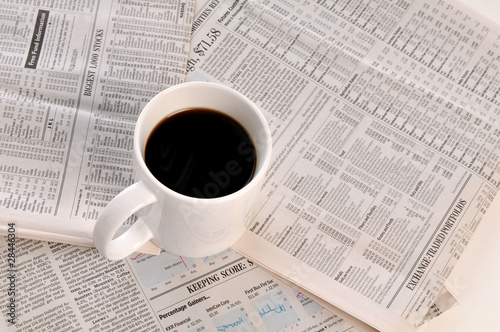 Businesspapers and cup of coffee photo