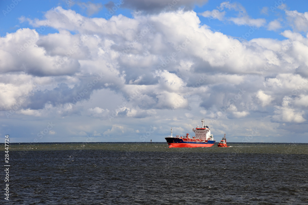Fototapeta Carriage of dangerous goods with the assist of a tug.
