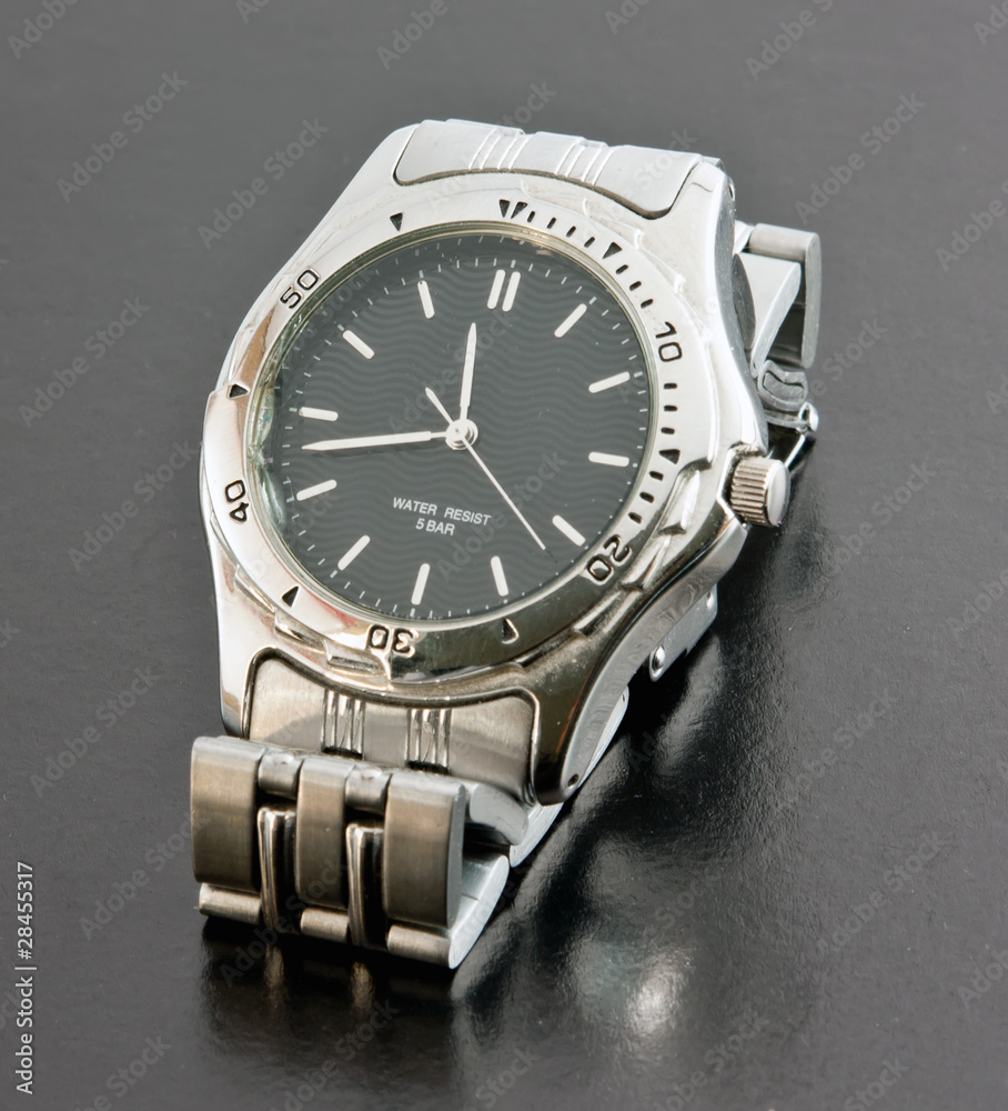 Wristwatch on a black background with reflect Wristwatch on a black background with reflect