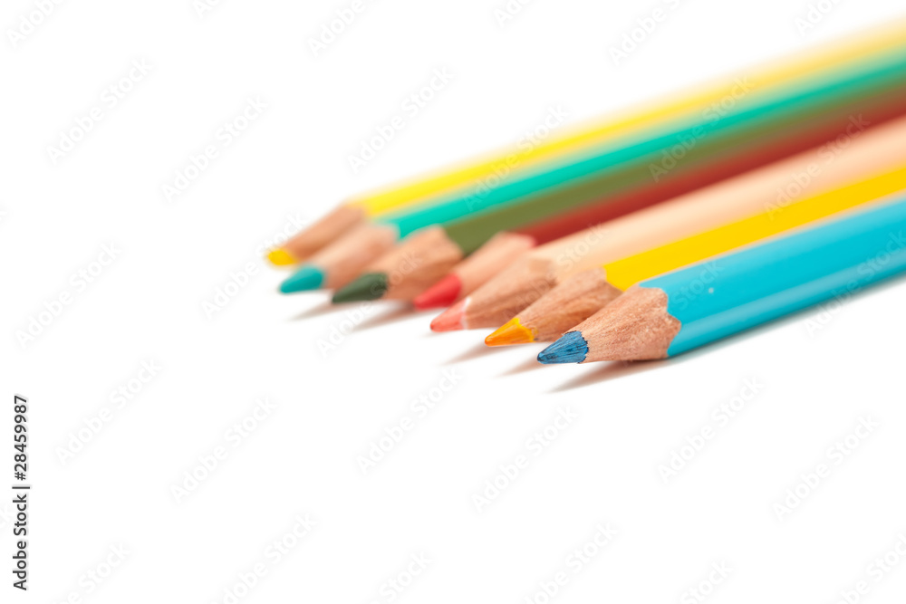 Many colored pencils isolated on white