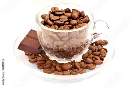 Cup filled with coffee beans and chocolate bar