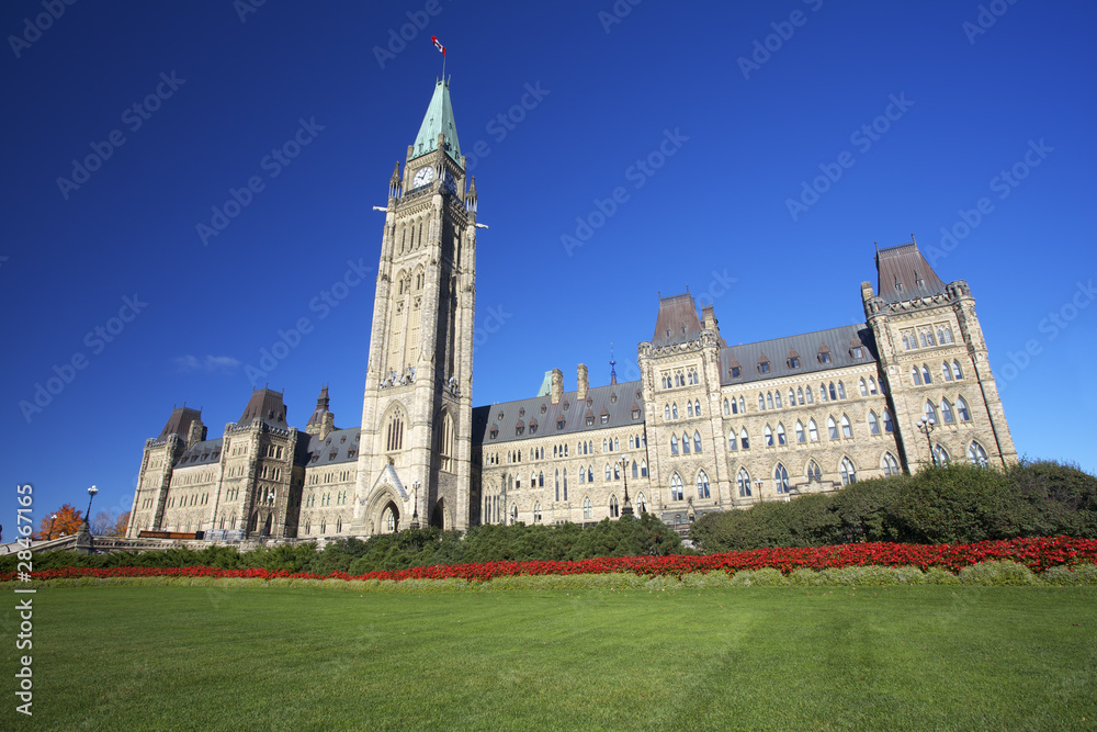 The Parliament of Canada with green grass the foreground The Parliament of Canada with green grass the foreground