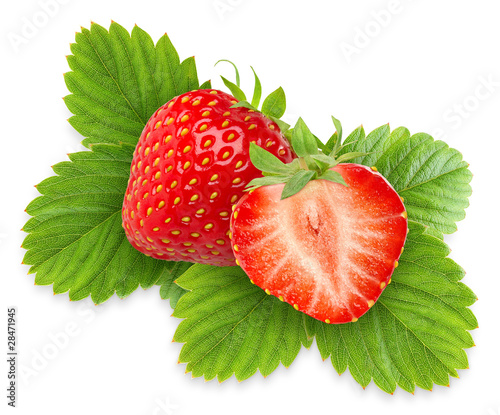 Isolated strawberries. Two strawberries, one cut in half over green leaves isolated on white background