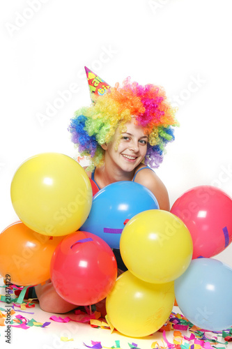 studio portrait of young happy woman with balloons