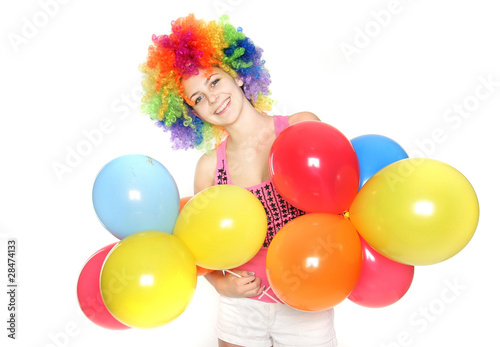 bright studio portrait of happy young woman with balloons