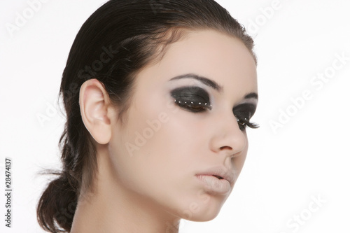 studio portrait of young beautiful woman with bright eye makeup