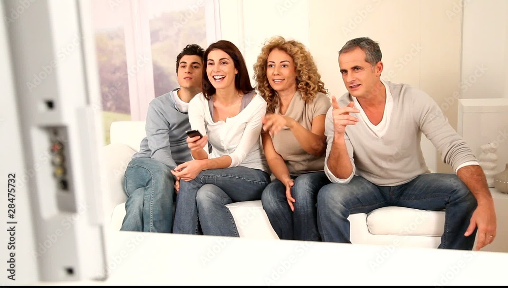 Group of friends watching movie on tv Group of friends watching movie on tv