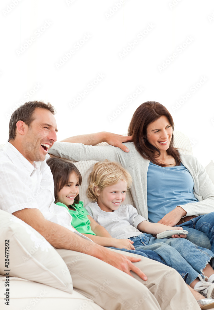 Happy family watching a movie together Happy family watching a movie together