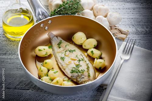 Photos sole fish with potatoes over casserole-sogliola e patate