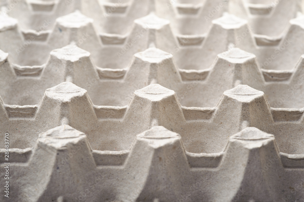 Fototapeta premium Empty cardboard egg holder, abstract stucture background