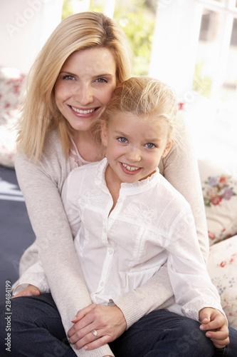 Woman and child pose in studio