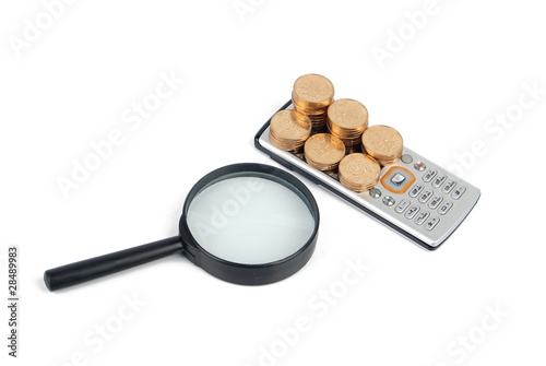 Coins and mobilephone with magnifier