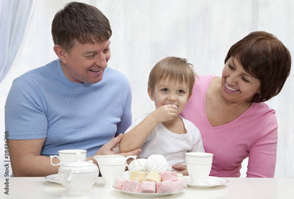 Mature couple with grandchild have a breakfast Mature couple with grandchild have a breakfast