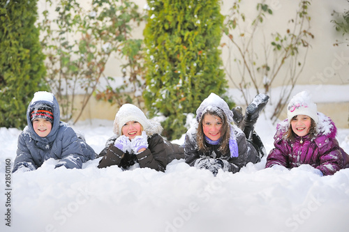 Children Laying On snow photo