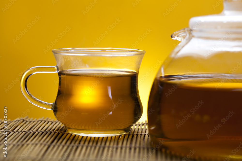 Glass teapot and cup with tea Glass teapot and cup with tea