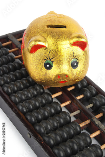 Piggy bank and abacus photo