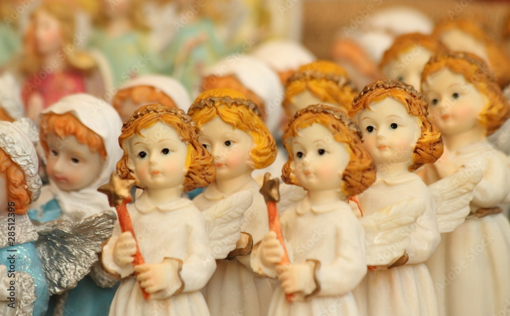 christmas angelic figurine with Bethlehem star in hand christmas angelic figurine with Bethlehem star in hand