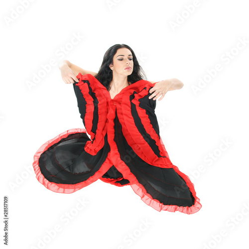 Tableau sur toile studio portrait of young beautiful woman dancing flamenco over w