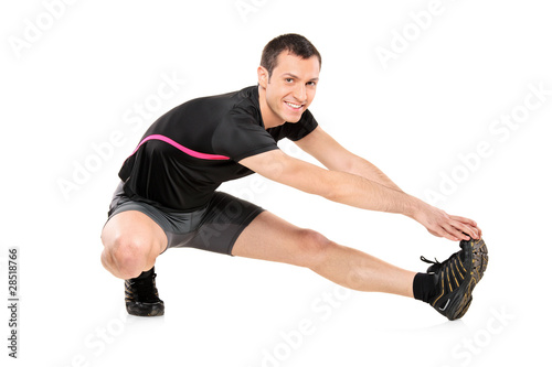 Full length portrait of a young athlete exercising