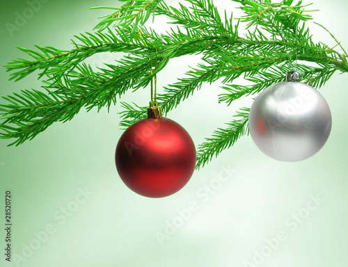 christmas balls hanging on fir branch