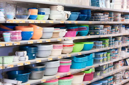 Plastic dishes on shop`s shelves