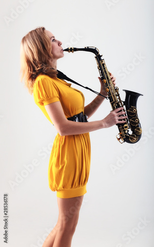 Canvas Print woman with saxophone.