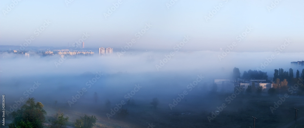 Fog over city. Panorama