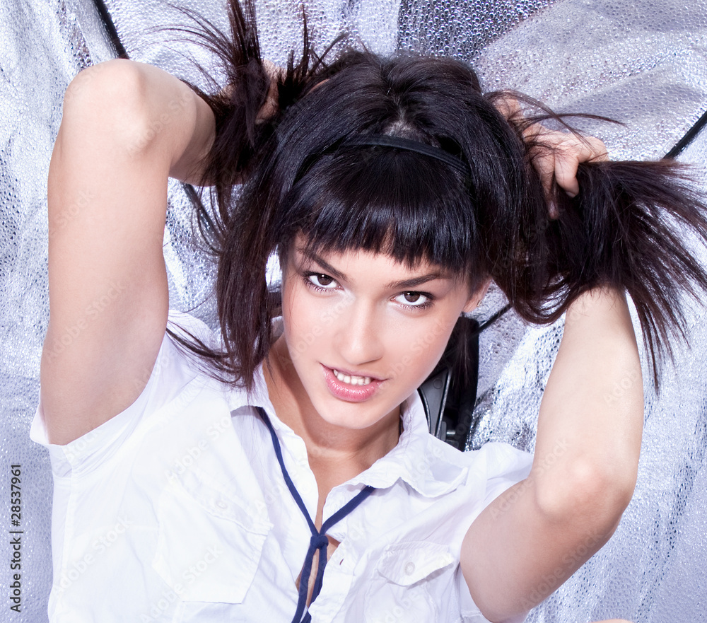 Close up Beautiful young brunette in white shirt posing Close up Beautiful young brunette in white shirt posing