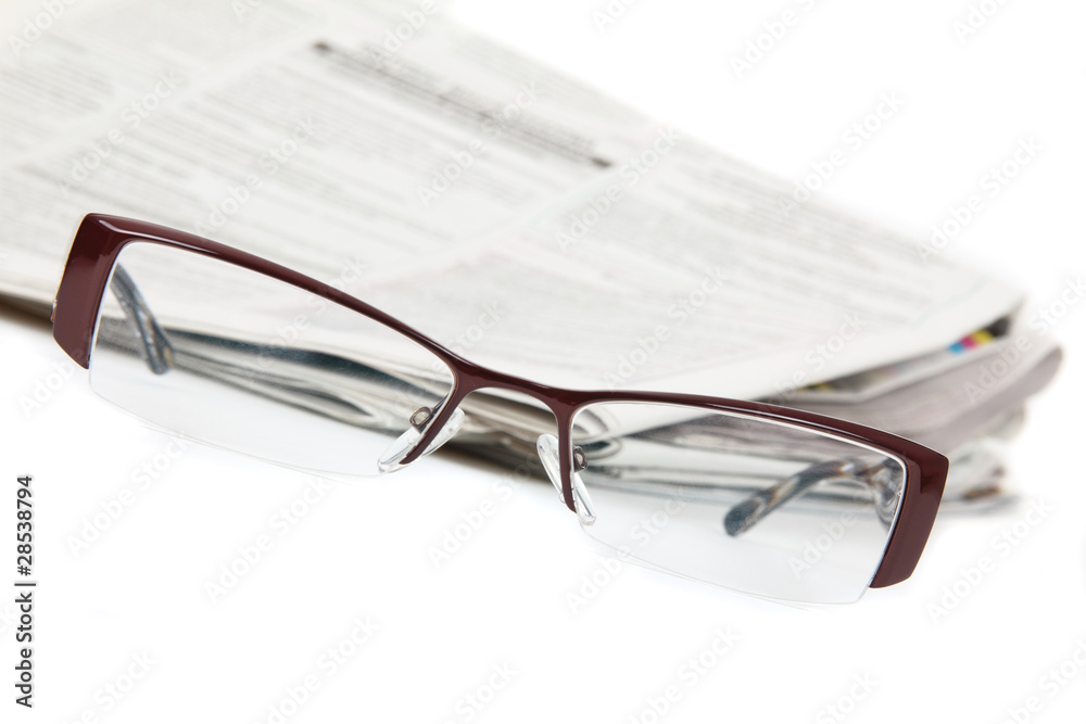 Modern eyeglasses and newspaper isolated on white Modern eyeglasses and newspaper isolated on white