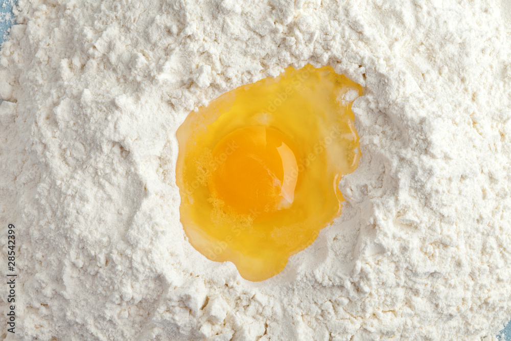 Broken egg on flour, means for making bread Broken egg on flour, means for making bread