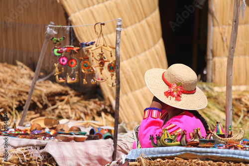 Vendor and her booth at the floating reedy island. Lake Titicaca