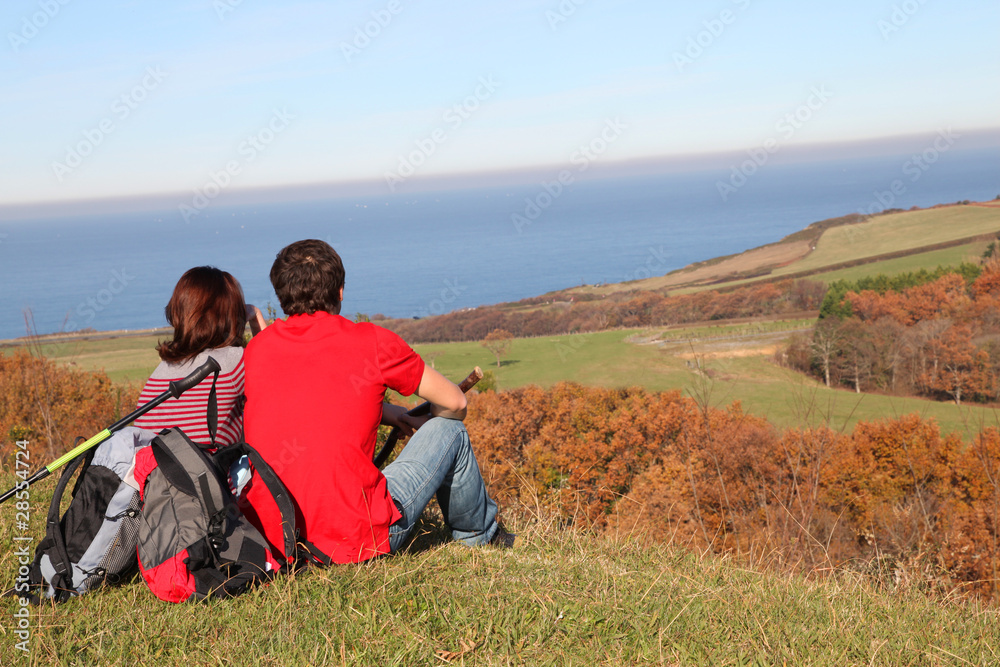 Couple hiking in countryside on beautiful fall day Couple hiking in countryside on beautiful fall day