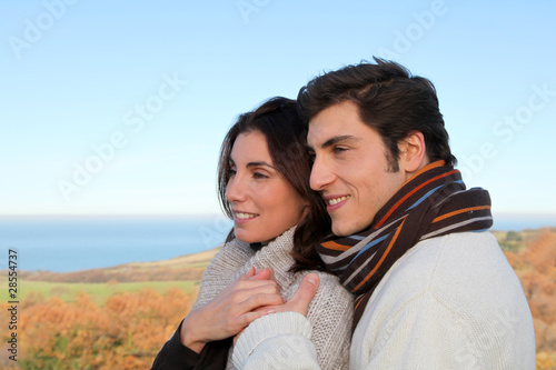 Portrait of happy couple in fall season © goodluz