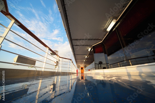 deck of cruise ship in morning shining by light of rising sun