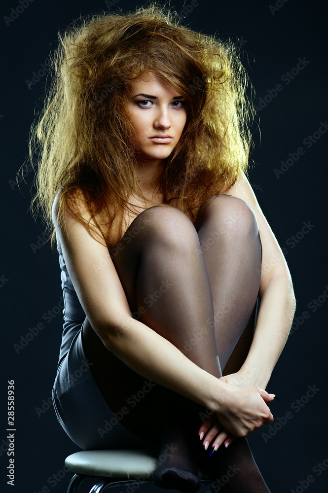 Naklejka premium Portrait of the beautiful girl with a mad hairdress