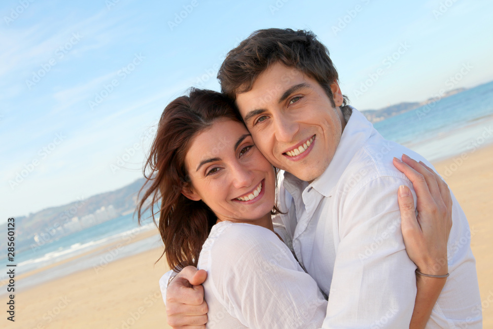 Portrait of lovely couple at the beach in summer Portrait of lovely couple at the beach in summer