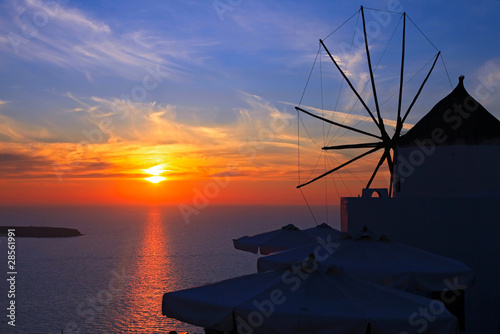 Windmill at sunset in Oia, Santorini island, Greece