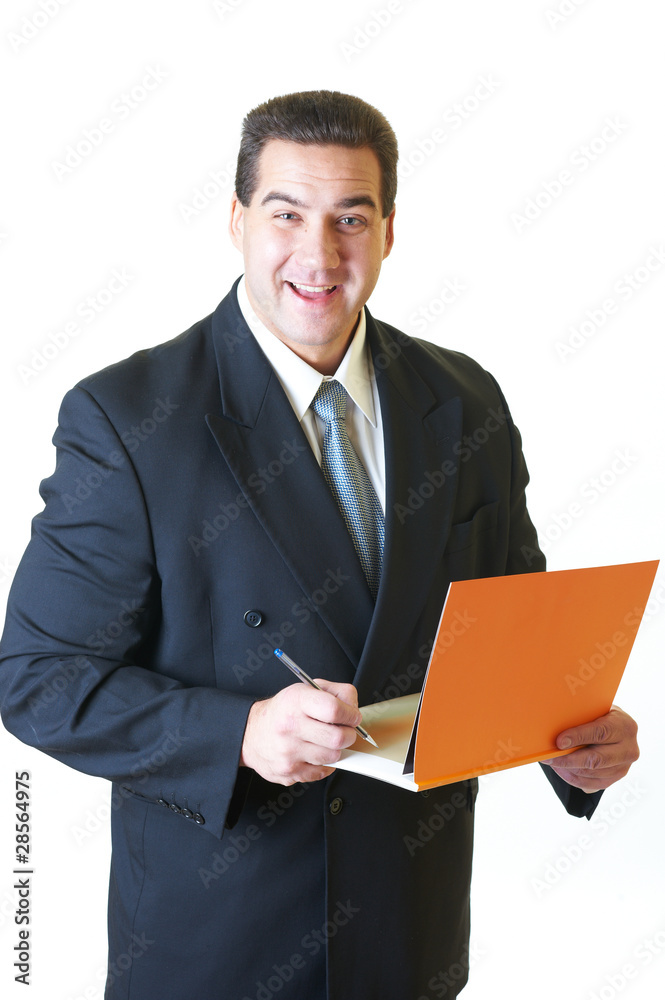 Attractive man in black suit with orange book and pen isolated o Attractive man in black suit with orange book and pen isolated o