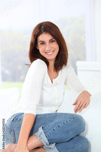 Young woman relaxing on sofa