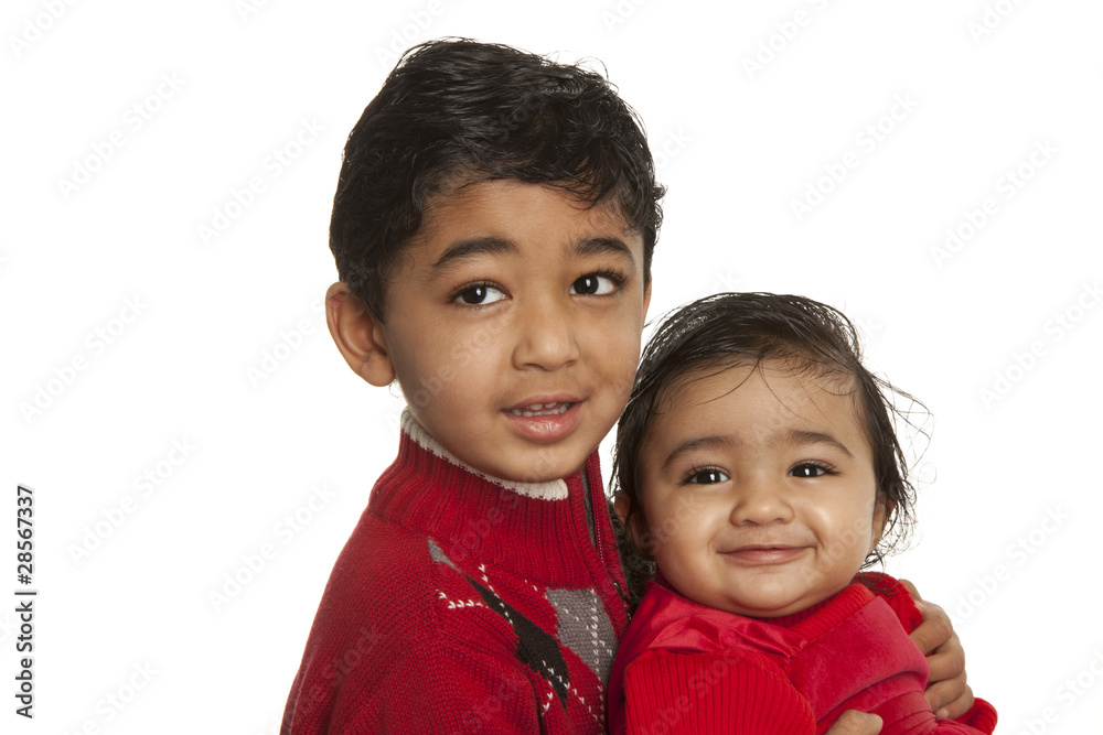 Smiling Siblings - Older Brother Holding Baby Sister Smiling Siblings - Older Brother Holding Baby Sister