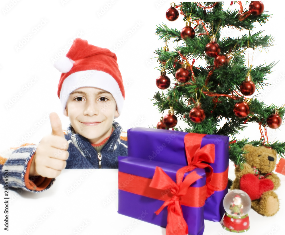 Boy and a Christmas Tree, showing OK sign. Boy and a Christmas Tree, showing OK sign.