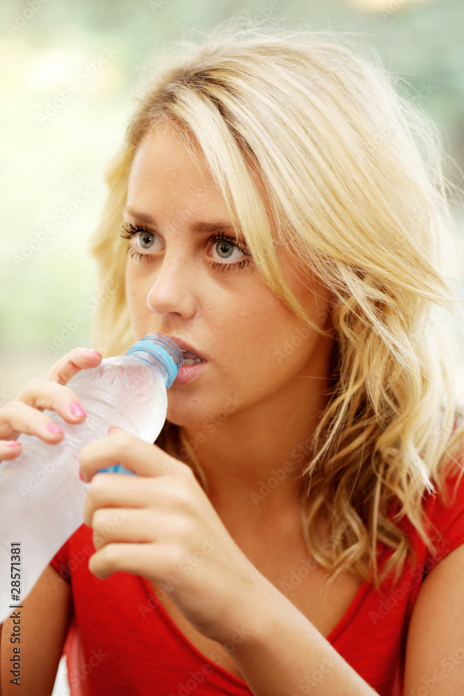 Teenage Girl Drinking Bottled Water. Model Released Teenage Girl Drinking Bottled Water. Model Released