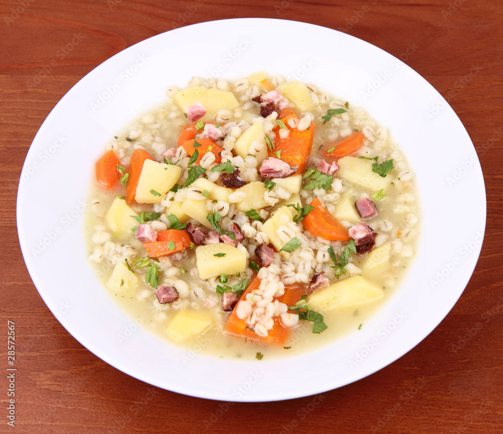 Barley soup on a wooden background Barley soup on a wooden background